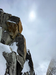 Cliff covered with snow on a cloudy day in Chamonix, France