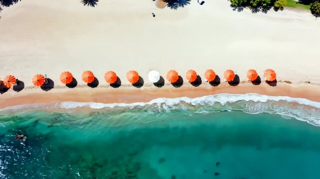 White parasol moving along orange parasols on tropical beach