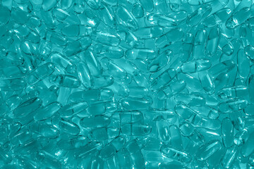 Aqua blue artificial capsules omega 3 background simple backdrop for presentation, screensaver,...