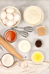 Recipe with eggs, flour, sugar, honey, cinnamon, yeast and butter. Kitchen background of cooking. Culinary ingredients for making pie and bread, Modern bakery concept