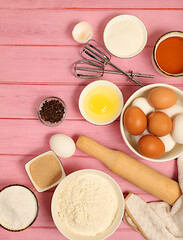 Recipe with eggs, flour, sugar, honey, cinnamon, yeast and butter. Kitchen background of cooking. Culinary ingredients for making pie and bread, Modern bakery concept