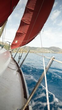 Close up vertical angle footage of a sailboat moving in the sea. Aegean Sea, Turkey