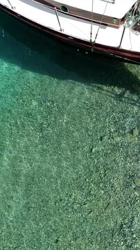 Close up vertical angle footage of a sailboat moving in the sea. Aegean Sea, Turkey