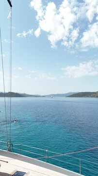 Close up vertical angle footage of a sailboat moving in the sea. Aegean Sea, Turkey