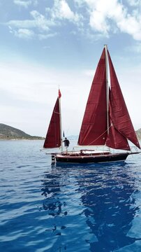 Close up vertical angle footage of a sailboat moving in the sea. Aegean Sea, Turkey