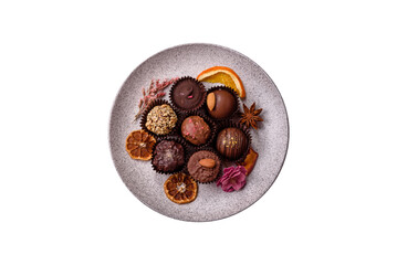 Homemade chocolate candies with different fillings and sprinkles