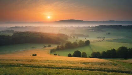 Sunrise over a peaceful countryside landscape