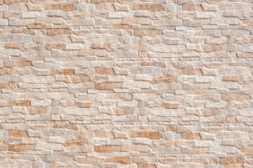 Fototapeta premium Texture of small bricks in warm shades