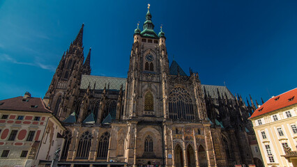 Fototapeta premium St. Vitus Cathedral timelapse hyperlapse in Prague surrounded by tourists.