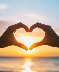Herzform mit H&auml;nden vor Sonnenuntergang am Meer, Heart shape with hands in front of sunset over the sea