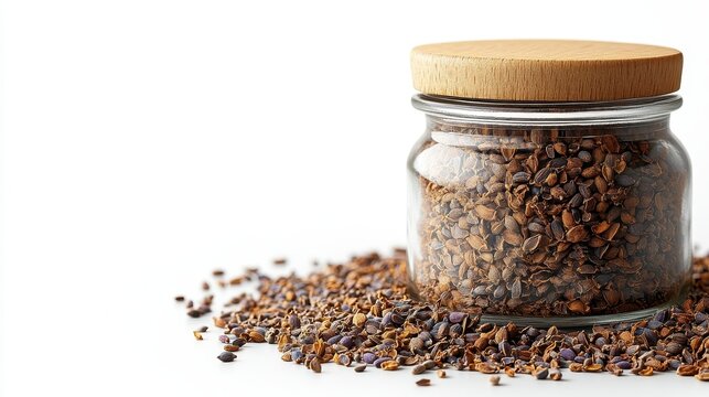 Dried cumin seeds in glass jar 