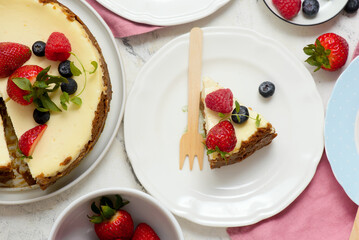 Pieces of cheesecake with berries on plates.top veiw..style hugge