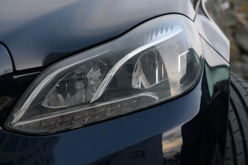 Obraz premium Sleek automotive design showcased in a close-up of a modern car headlight