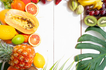 Summer mix of tropical fruits over white