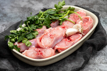 Fresh raw rabbit meat on dish