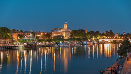 Torre del Oro day to night timelapse on Guadalquivir River in Seville, Spain