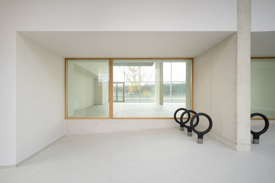 Modern minimalist interior with concrete and glass elements