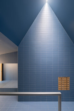Modern sustainable architecture featuring vibrant blue tiles