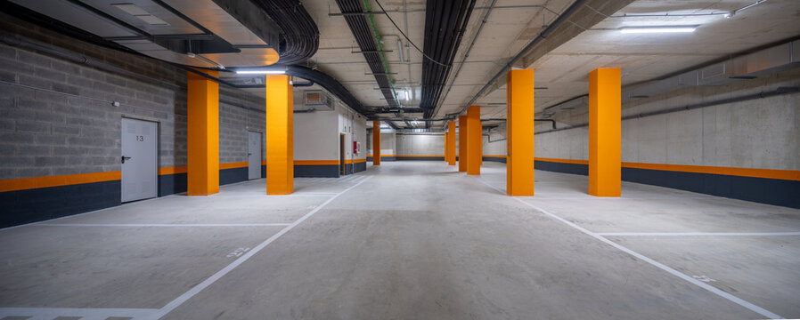 Modern parking garage with vibrant orange columns