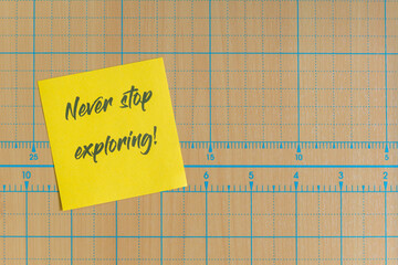 Colored paper note with adhesive tape with motivational phrases, post it glued on a very nice wooden board, copy space