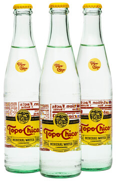 Three Glass Bottles of Made in Mexico Topo Chico brand carbonated mineral water on a transparent background