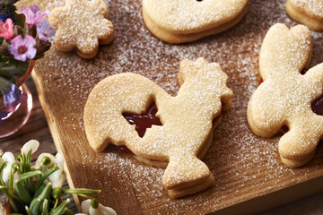 Linzer cookie in the shape of Easter animals filled with strawberry marmalade and dusted with sugar