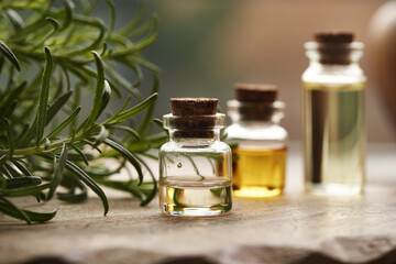 A bottle of rosemary essential oil on a table