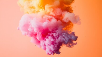 Fototapeta premium A colorful cloud of pastel pigments swirls in the air, creating a soft, ethereal blend of vivid pinks, oranges, and yellows against a warm background.