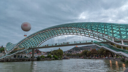 Timelapse of the Bridge of Peace, a bow-shaped pedestrian bridge in Tbilisi, Georgia © HyperlapsePro