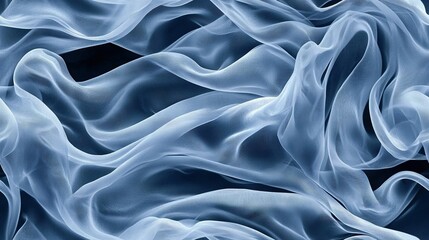 Obraz premium A blue-and-white fabric with wavy lines, set against a black backdrop