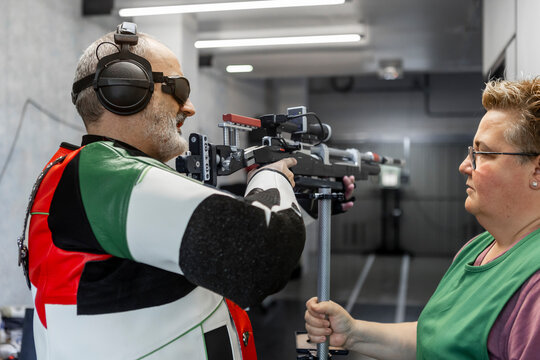 Blind athlete in professional shooting competition focus