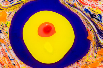 Vibrant abstract paint swirl with concentric circles