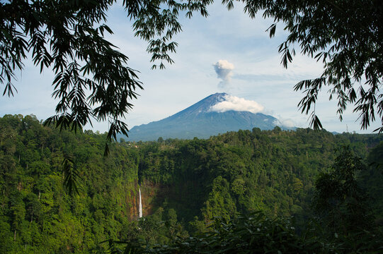 Scenic view of Kaspa Biru Waterfall with lush forest and waterfall