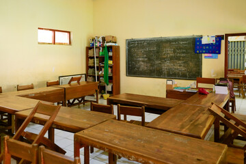 Empty classroom with traditional wooden desks in Java, Indonesia
