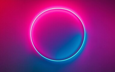Fototapeta premium A neon circular light design glowing on a gradient background of pink and blue colors. Concept of modern art and lighting design.