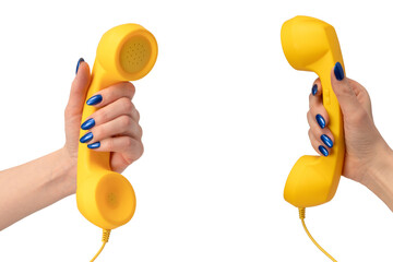 Yellow handset in woman hand isolated on white. Copy space.