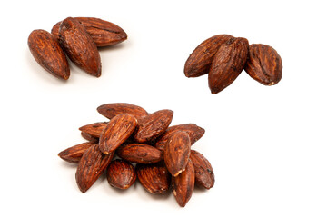 A group of caramelized almonds isolated on a white background.