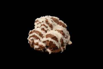 Profiteroles with coconut cream on a black background.