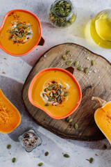 Traditional autumn butternut squash soup with seeds.