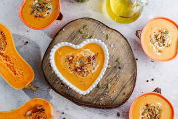 Traditional autumn butternut squash soup with seeds.
