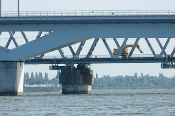 Fototapeta premium Construction work takes place on Moerdijkbruggen, showcasing the bridge's modern engineering and maintenance efforts