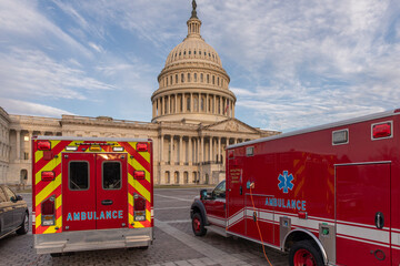 Capitol building and emergency ambulance vehicles