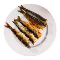 Grilled atlantic sardine fish served on platter in cafe. Isolated over white background