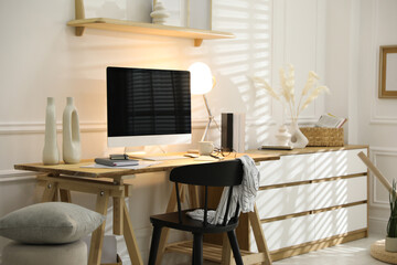 Comfortable workplace with computer in home office