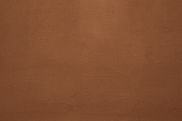 red pink brown  painted wall background. paint stucco plaster fence floor texture as backdrop. top front view.