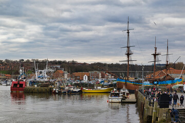 Whitby Harbor View with Boats, Pier, and Buildings