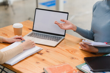Business Meeting with Laptop and Documents