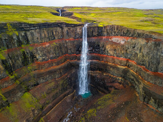 Aerial drone view of Hengifoss waterfall landscape in Iceland.