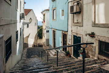 Naklejka premium Narrow and picturesque streets of the Alfama district in Lisbon
