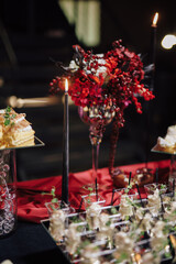 A buffet at an event with red decor